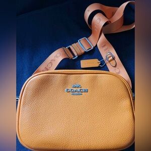 Orange Coach crossbody leather bag